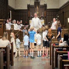 Children gathered at the front of the church for a children’s sermon